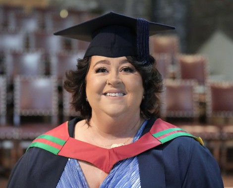 Kate Walker wearing her graduation cap and gown.